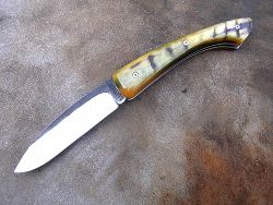 Couteau pliant L.LATASTE manche en très vieux châtaignier et lame en acier xc75 brut de forge avec volute forgée