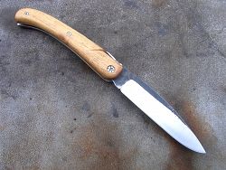 Couteau LOU PALOUMAYRE manche en ébène avec ressort guilloché et lame acier OXYDABLE