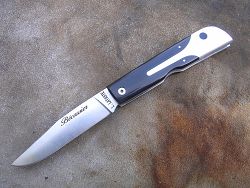Couteau LE BECASSIER avec un manche en ébène.