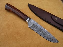 Couteau L.LATASTE manche ébène et phacochère avec lame en damas forgé.
