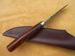 Couteau L.LATASTE manche en bois de fer avec lame en damas forgé, guillochage et volute volute forgée.