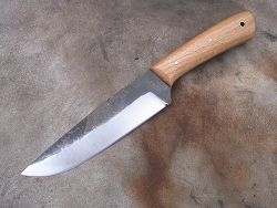 Couteau L.LATASTE manche en ivoire de phacochère avec lame en damas forgé.